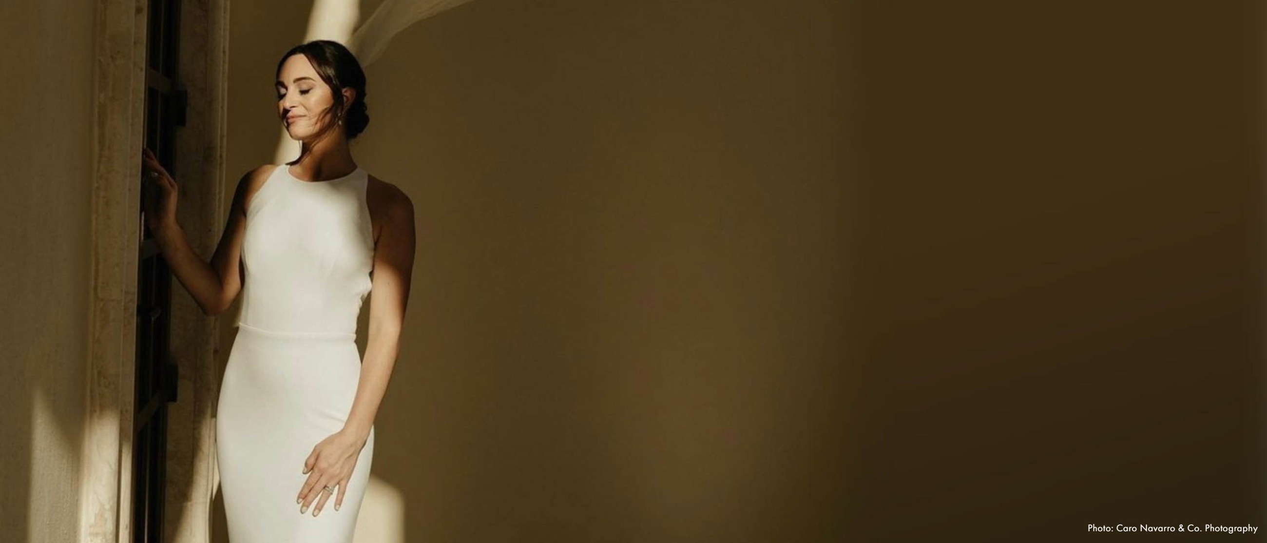 Model wearing a white gown